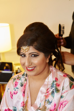 Indian bride getting her hair done Indian bride getting her hair done