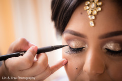 Lovely bride getting her makeup done Lovely bride getting her makeup done