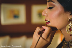 Lovely bride getting her makeup done Lovely bride getting her makeup done