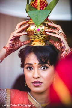 Indian wedding guest holding decorated coconut Indian wedding guest holding decorated coconut