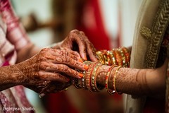 Indian bride being helped to get ready Indian bride being helped to get ready