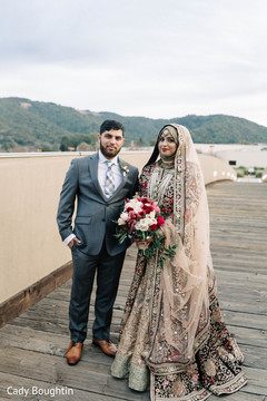 Indian bride and groom glowing in their wedding attire. Indian bride and groom glowing in their wedding attire.