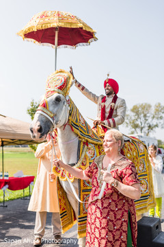 Elegant indian groom riding baraat white horse Elegant indian groom riding baraat white horse