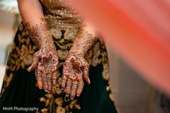 Indian bride showing mehndi art Indian bride showing mehndi art