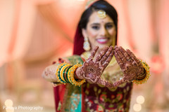 Indian bride showing mehndi art Indian bride showing mehndi art