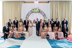 Glamorous indian bride and groom with bridesmaids and groomsmen Glamorous indian bride and groom with bridesmaids and groomsmen