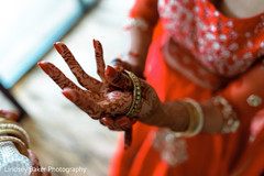 Indian bride placing her bangles on. Indian bride placing her bangles on.