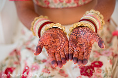 Indian bride showing mehndi art Indian bride showing mehndi art