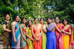 Adorable indian bride posing with bridesmaids Adorable indian bride posing with bridesmaids