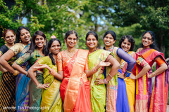 Beautiful indian bride posing with bridesmaids for photo shoot Beautiful indian bride posing with bridesmaids for photo shoot