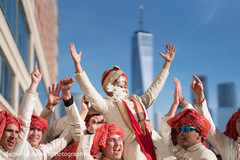 Indian groom being lifted up during baraat pre- wedding celebrations,indian wedding baraat,baraat,indian groom