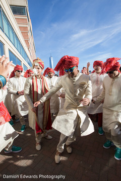 Vibrant indian groomsman dancing pre- wedding celebrations,indian wedding baraat,baraat