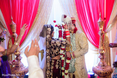 Traditional indian couple's jai mala ritual Traditional indian couple's jai mala ritual