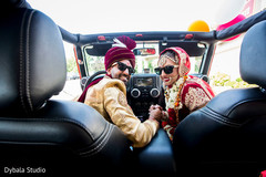 Sweet indian couple inside wedding car Sweet indian couple inside wedding car