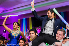 Indian newlyweds being lifted up indian wedding reception,indian wedding gallery,indian bride and groom