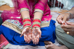 Indian bride showing mehndi art Indian bride showing mehndi art