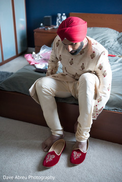 Indian groom putting shoes Indian groom putting shoes