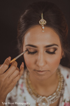 Lovely bride getting her makeup done Lovely bride getting her makeup done