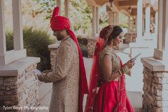 Adorable indian couple reading each others letters Adorable indian couple reading each others letters