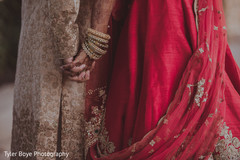 Beautiful capture of indian bride and groom holding hands Beautiful capture of indian bride and groom holding hands