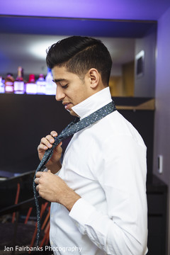 Charming indian groom getting ready scene Charming indian groom getting ready scene