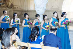 Indian bridesmaids during wedding ceremony Indian bridesmaids during wedding ceremony