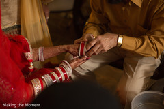 Sweet indian bride putting bangles on Sweet indian bride putting bangles on