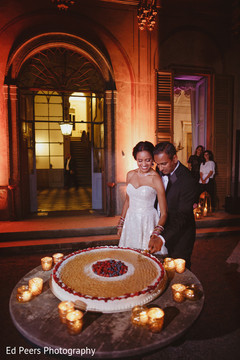 Cutting the cake moment indian wedding reception,indian wedding reception photography,indian bride and groom