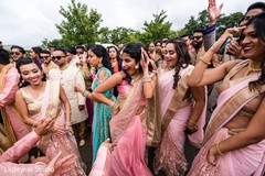 Indian bridesmaids dancing during baraat Indian bridesmaids dancing during baraat