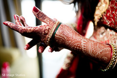 Sweet indian bride putting bangles on Sweet indian bride putting bangles on