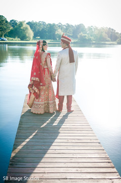Indian bride and groom's romantic first look moment Indian bride and groom's romantic first look moment