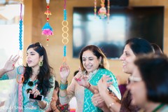 Indian wedding guests during mehndi party Indian wedding guests during mehndi party