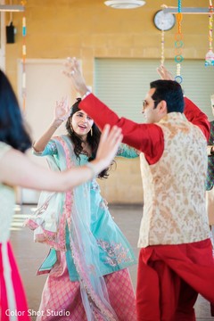 Indian groom dancing during mehndi party Indian groom dancing during mehndi party