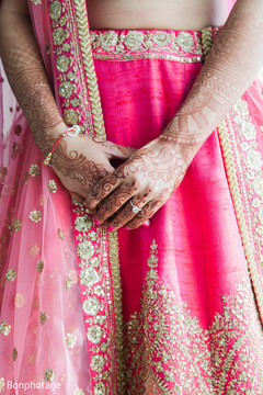Beautiful indian bride showing henna art. Beautiful indian bride showing henna art.
