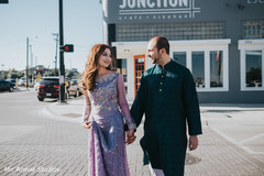 Cute indian couple walking holding hands Cute indian couple walking holding hands