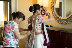 Beautiful indian bride getting ready.