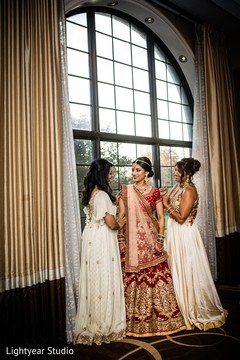 Indian bride being helped to get ready Indian bride being helped to get ready