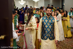 Joyful Indian groom on his sangeet sherwani. indian groom,indian wedding celebration,indian groom fashion
