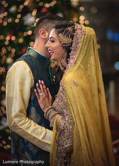 Joyful bride sharing moment wiht groom. indian bride and groom,indian wedding fashion,indian wedding hair and makeup,indian wedding jewelry