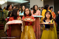 Little lovely Indian bridesmaids caring the ritual accessories. indian wedding sangeet,indian wedding fashion,indian sangeet traditions