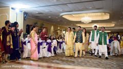 Gorgeous Indian groom entrance with his parents to the sangeet celebration. indian groom,indian wedding sangeet,indian wedding fashion