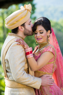 Indian groom kissing the bride Indian groom kissing the bride