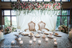 Enchanting Indian bride and groom reception table decoration. Enchanting Indian bride and groom reception table decoration.