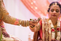 Indian bride holding ceremonial leaf. indian wedding ritual,indian bride,indian wedding traditions