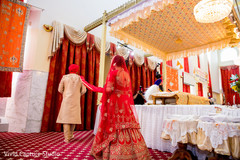 Indian bride following groom on a wedding ritual. Indian bride following groom on a wedding ritual.