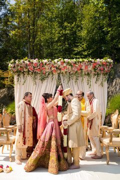 Indian bride and groom exchanging garlands ceremony. Indian bride and groom exchanging garlands ceremony.