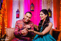 Indian groom admiring bridal mehndi art indian wedding gallery,pre- wedding celebrations,mehndi art,indian bride and groom