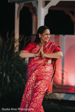 Indian brides mother dance in the sangeet celebration. Indian brides mother dance in the sangeet celebration.