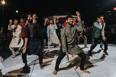 Indian groom's sangeet performance. Indian groom's sangeet performance.