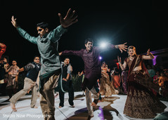 Indian bridesmaids and groomsmen upbeat dance . Indian bridesmaids and groomsmen upbeat dance .